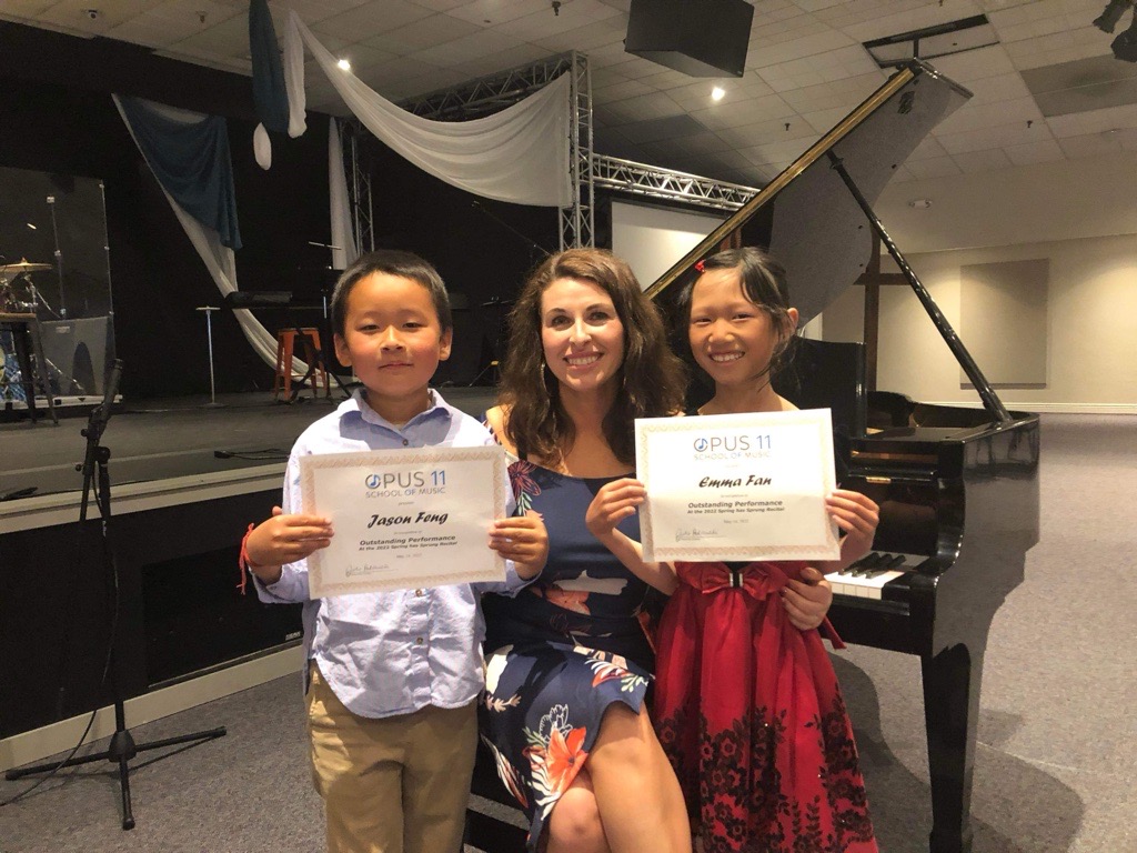 Julie Poklewski with Opus11 students holding certificates